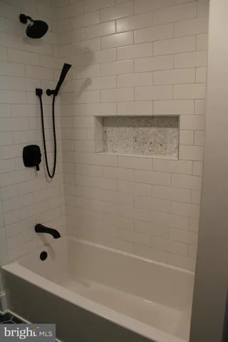 a view of storage and utility room with washer and dryer