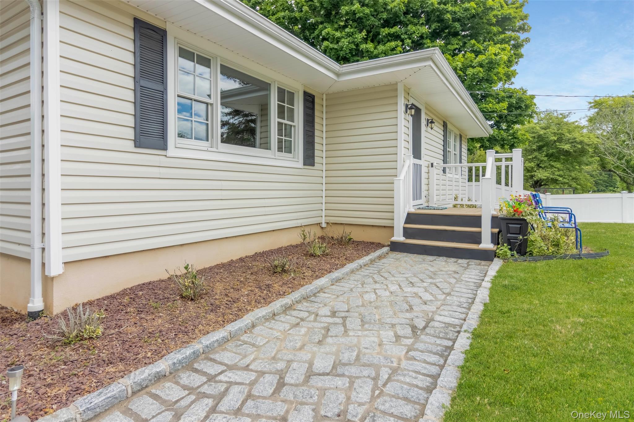 315 Wicks Road New Suffolk, NY 11956 - Photo 4 of 28 a view of a house with backyard and sitting area