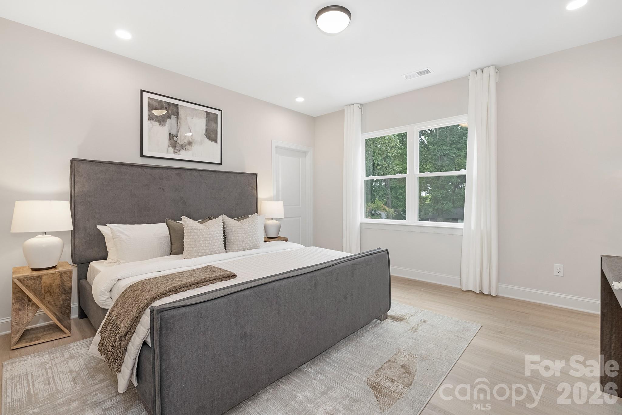 4015 Oakdale Road Charlotte, NC 28216 - Photo 11 of 30 a bed room with a bed and a window