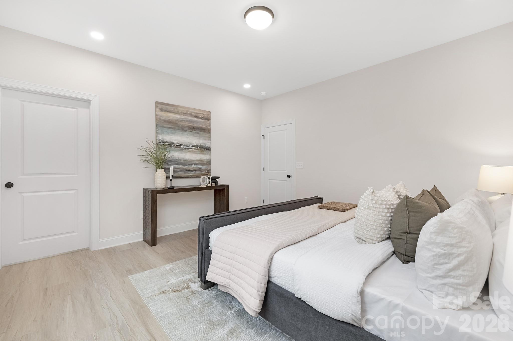 4015 Oakdale Road Charlotte, NC 28216 - Photo 12 of 30 a bedroom with a bed and a window