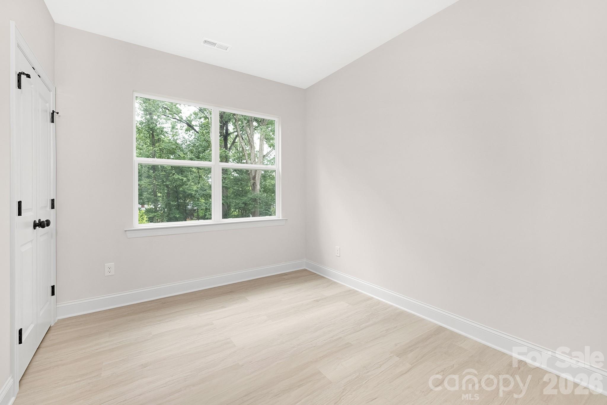 4015 Oakdale Road Charlotte, NC 28216 - Photo 14 of 30 an empty room with a window