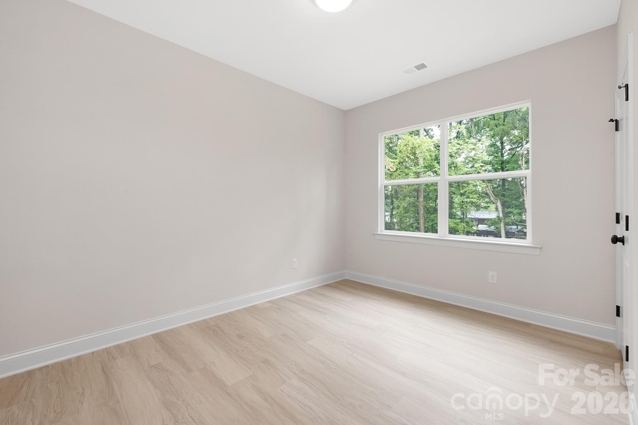 4015 Oakdale Road Charlotte, NC 28216 - Photo 17 of 30 an empty room with a window