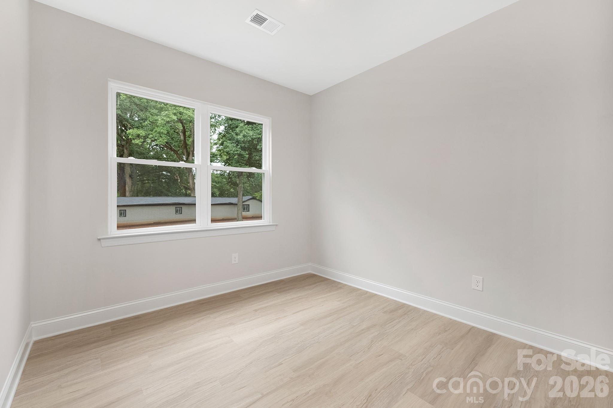 4015 Oakdale Road Charlotte, NC 28216 - Photo 18 of 30 an empty room with a window