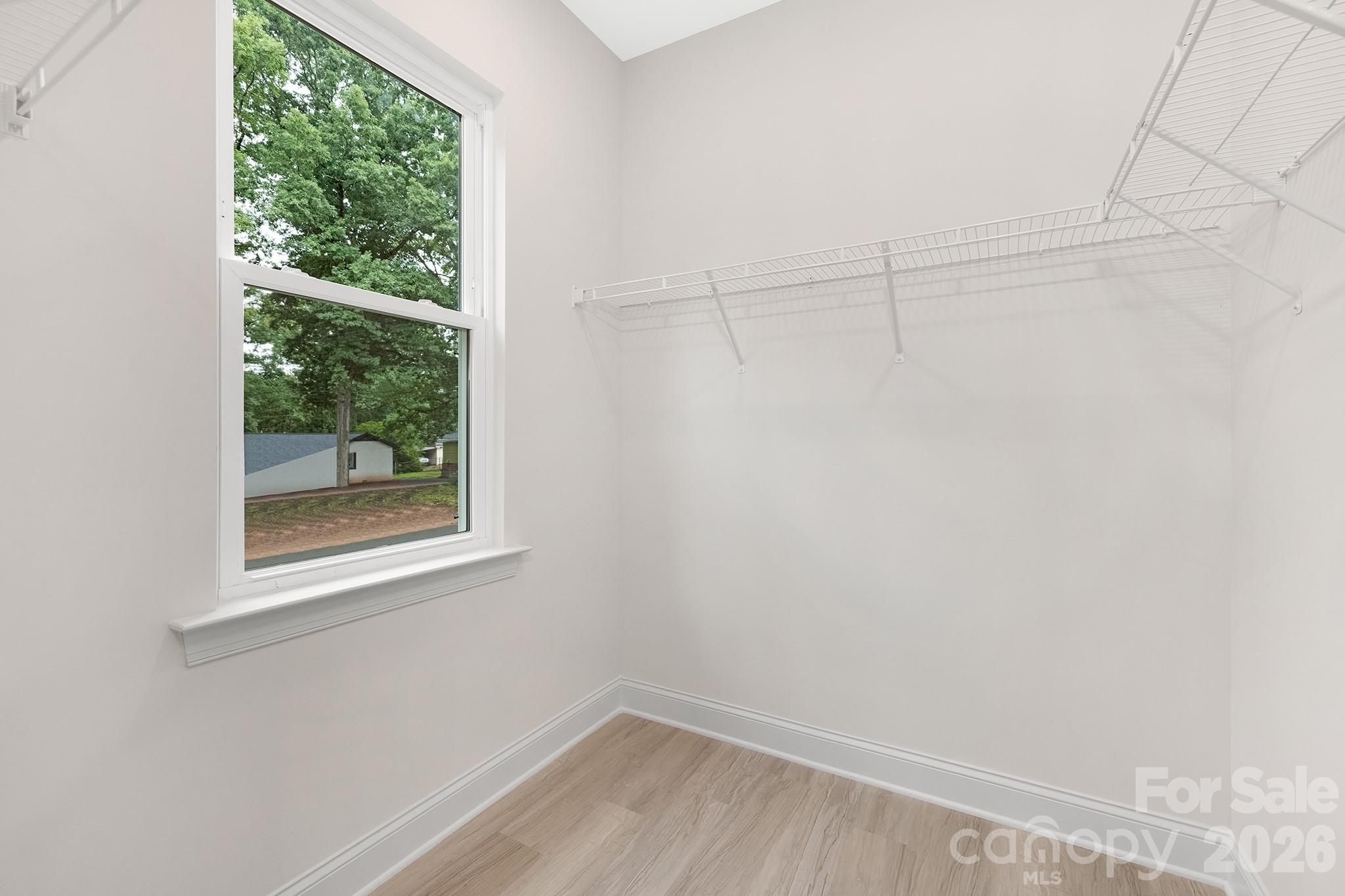 4015 Oakdale Road Charlotte, NC 28216 - Photo 19 of 30 a view of a small space with wooden floor and a window