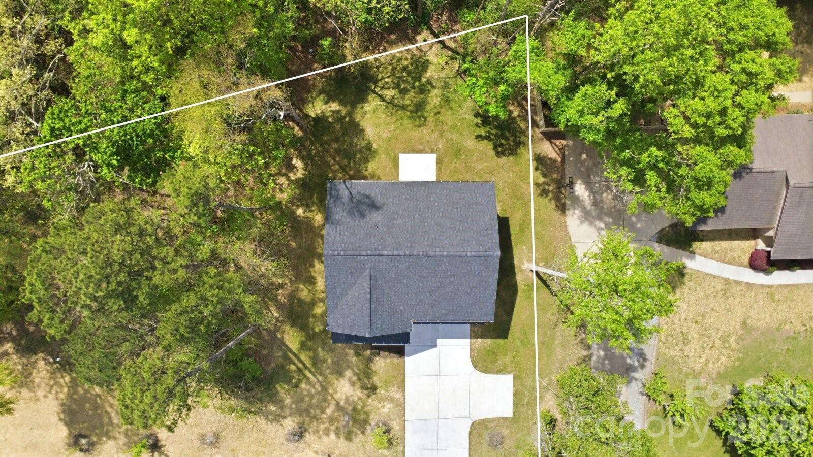 4015 Oakdale Road Charlotte, NC 28216 - Photo 24 of 30 a view of a house with a tree and a yard