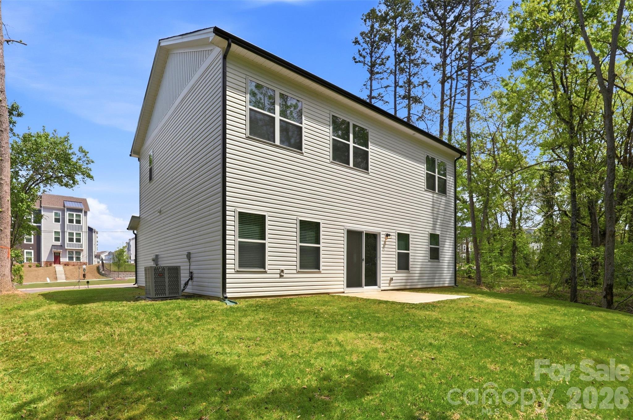 4015 Oakdale Road Charlotte, NC 28216 - Photo 25 of 30 a view of a house with backyard and a tree