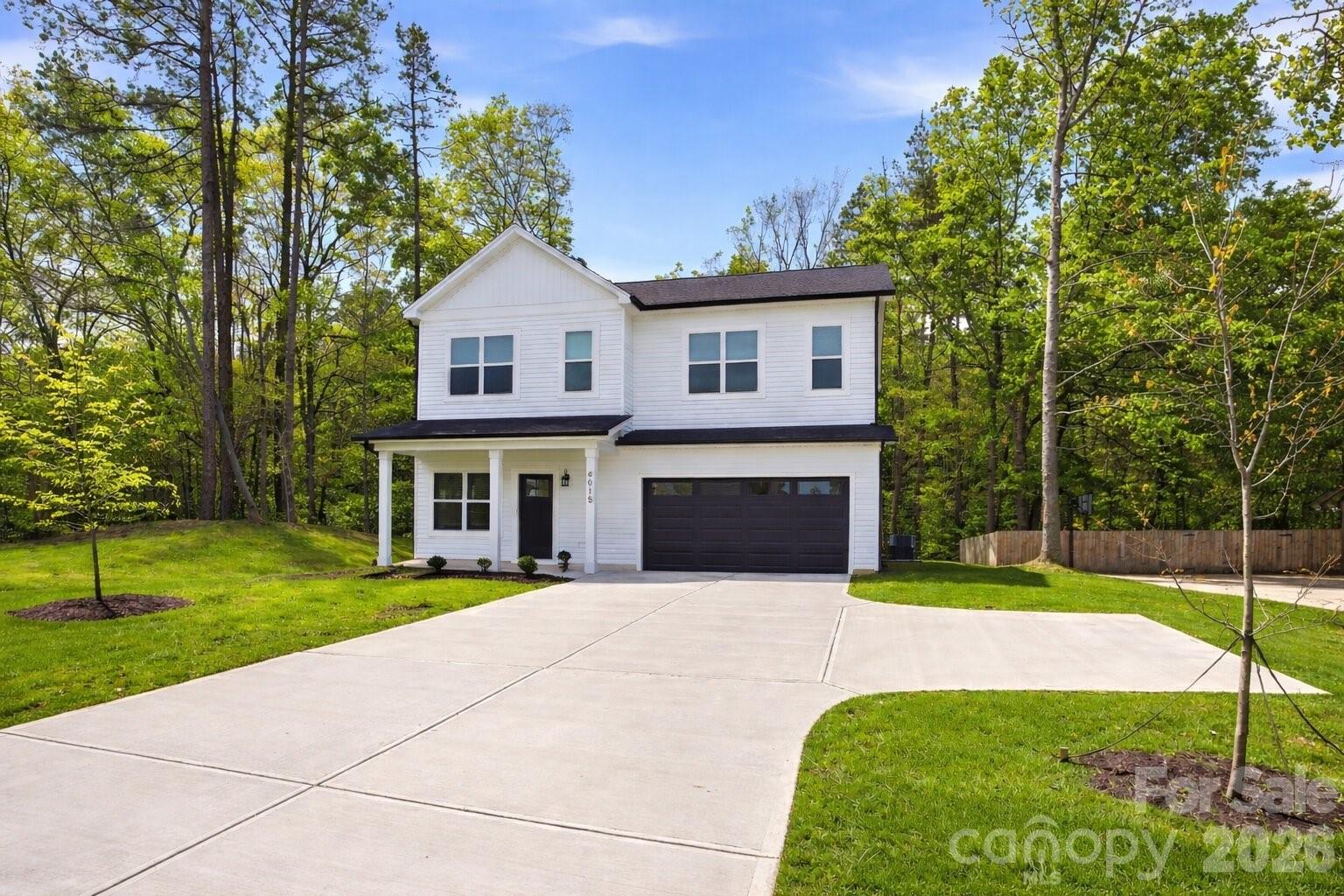 4015 Oakdale Road Charlotte, NC 28216 - Photo 28 of 30 a front view of a house with yard and green space