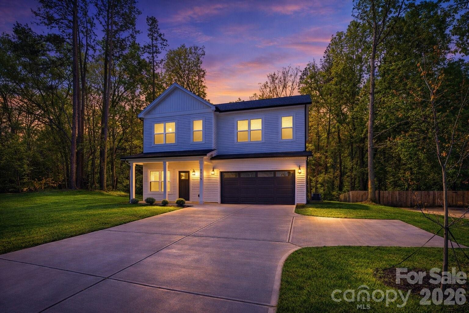 4015 Oakdale Road Charlotte, NC 28216 - Photo 29 of 30 a front view of a house with yard and green space