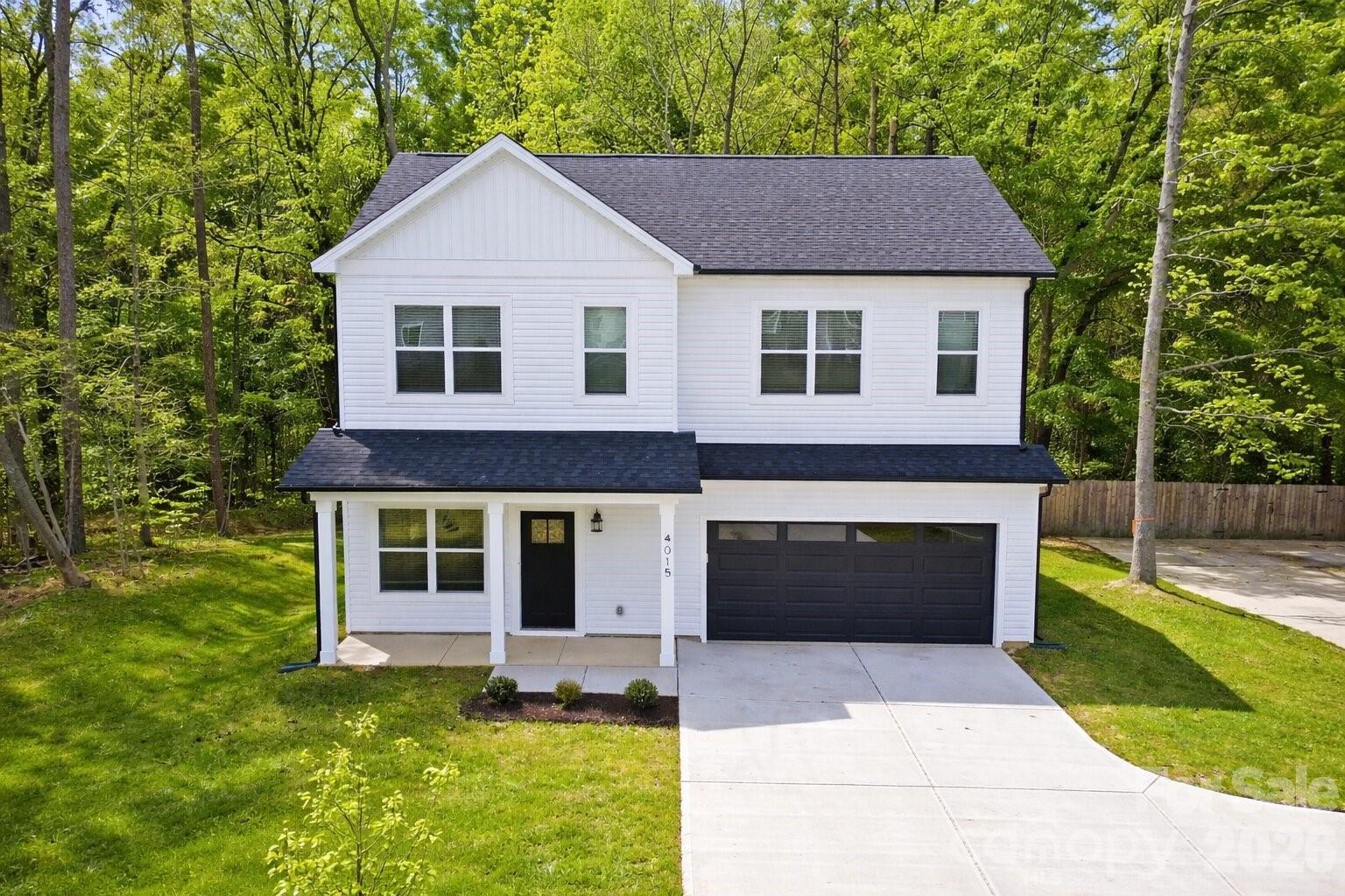 4015 Oakdale Road Charlotte, NC 28216 - Photo 30 of 30 a front view of a house with a yard and garage
