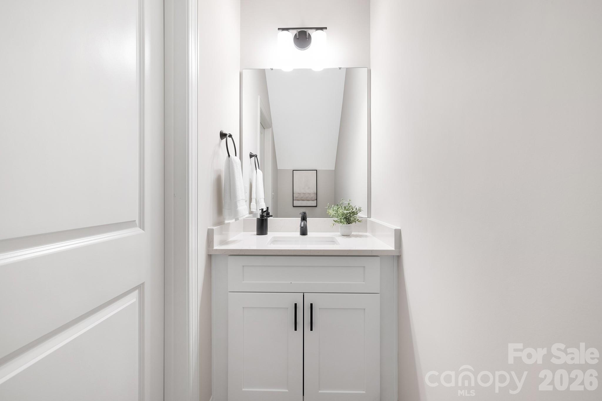 4015 Oakdale Road Charlotte, NC 28216 - Photo 10 of 30 a bathroom with a granite countertop sink and a mirror