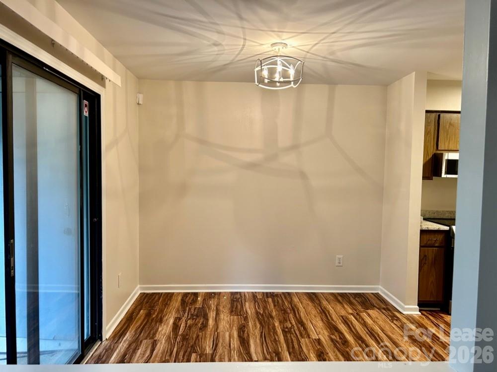 11020 Harrowfield Road Charlotte, NC 28226 - Photo 6 of 14 a view of a room with wooden floor