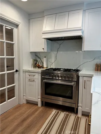 a bathroom with a granite countertop toilet sink and shower