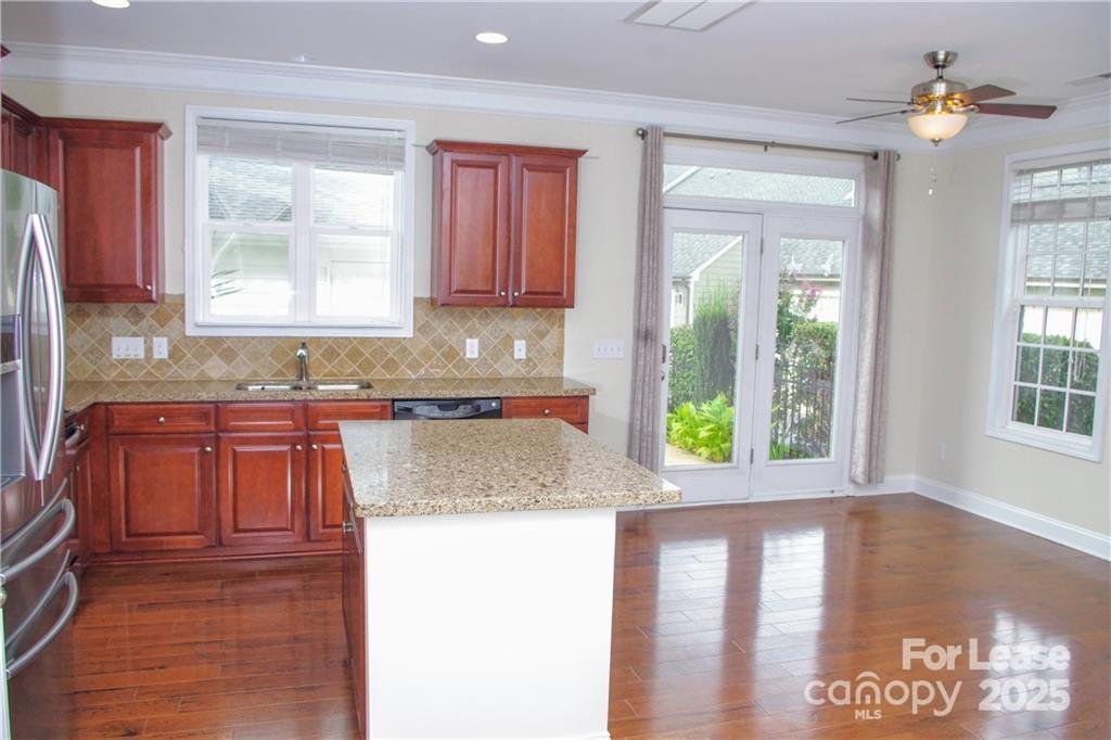 916 Gardners Way Cornelius, NC 28031 - Photo 12 of 35 a kitchen with a window a counter top space and living room