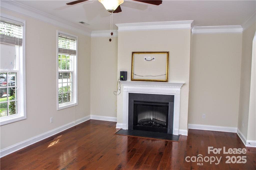 916 Gardners Way Cornelius, NC 28031 - Photo 17 of 35 a view of an empty room with wooden floor and a window
