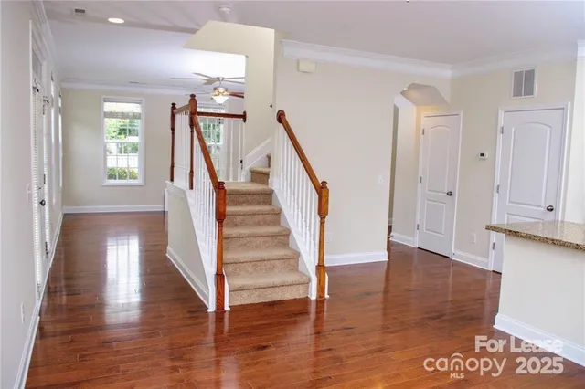 a view of entryway with wooden floor