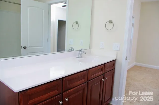a bathroom with a bath tub with a shower