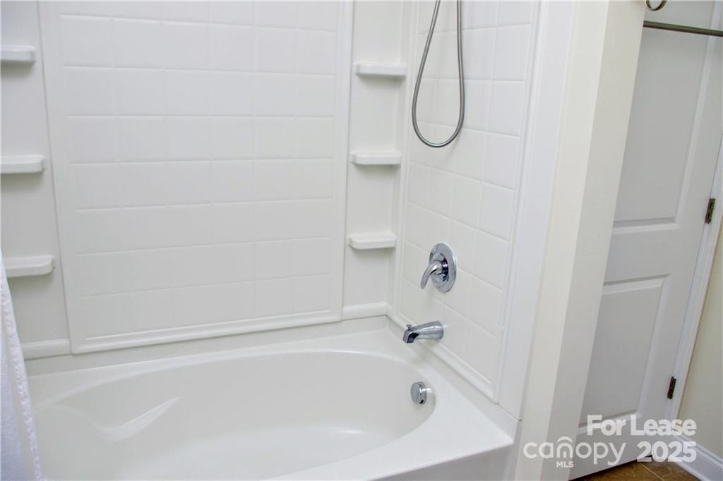 916 Gardners Way Cornelius, NC 28031 - Photo 28 of 35 a bathroom with a bath tub with a shower