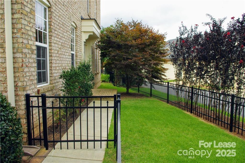 916 Gardners Way Cornelius, NC 28031 - Photo 4 of 35 a view of house with backyard and trees