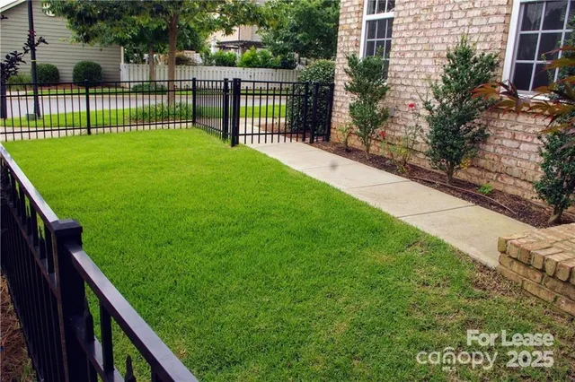 a view of a yard and front of a house