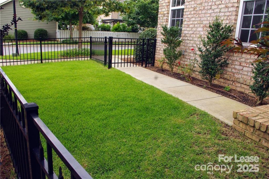 916 Gardners Way Cornelius, NC 28031 - Photo 6 of 35 a view of a yard and front of a house