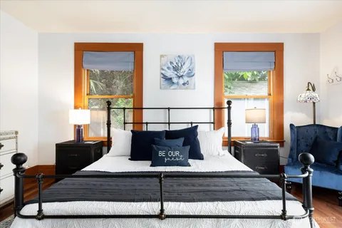 a bedroom with a bed and window