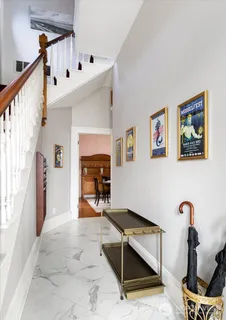 a reading room with furniture and rug