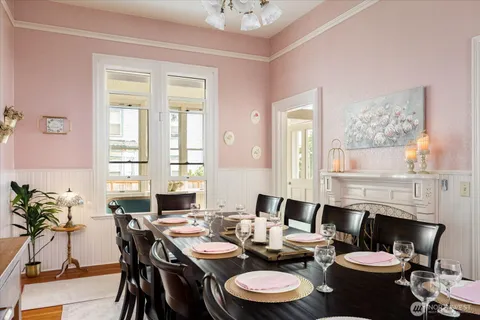 a view of a dining room with furniture window and wooden floor
