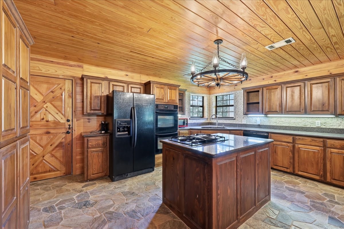13480 Craigen Road Beaumont, TX 77705 - Photo 11 of 39 Kitchen Island features a Gas Cooktop, and a Granite Countertop