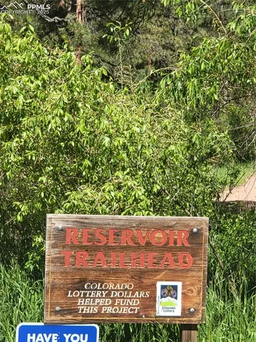 a sign board with a lake view