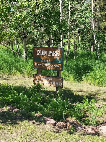 a view of a yard with swimming pool