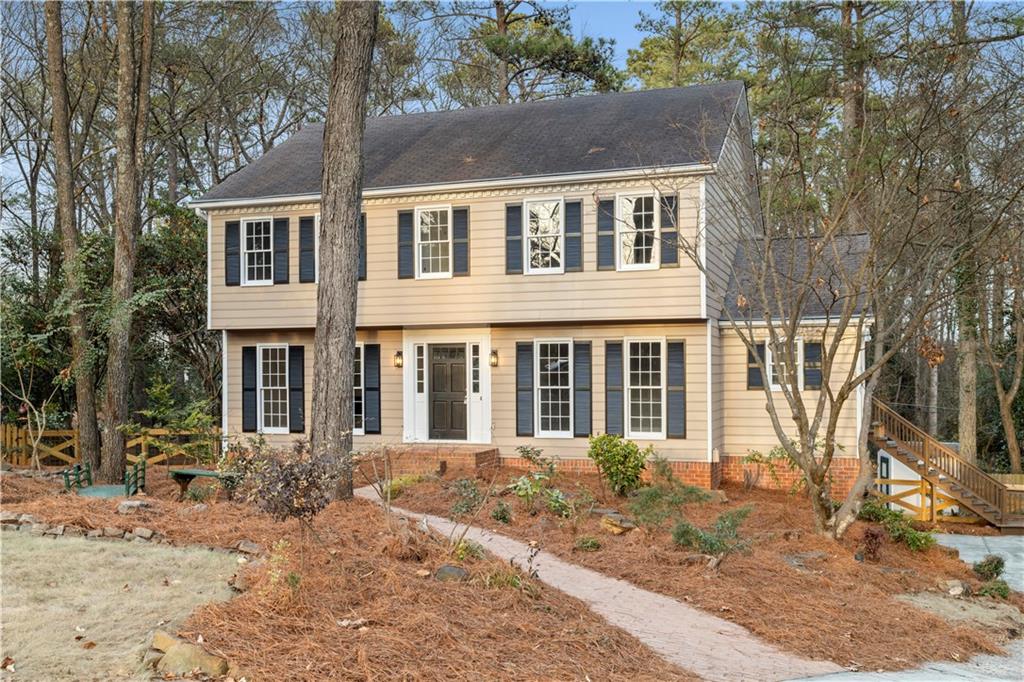 3907 Brinton Mill Road Marietta, GA 30062 - Photo 1 of 61 a front view of a house with a yard