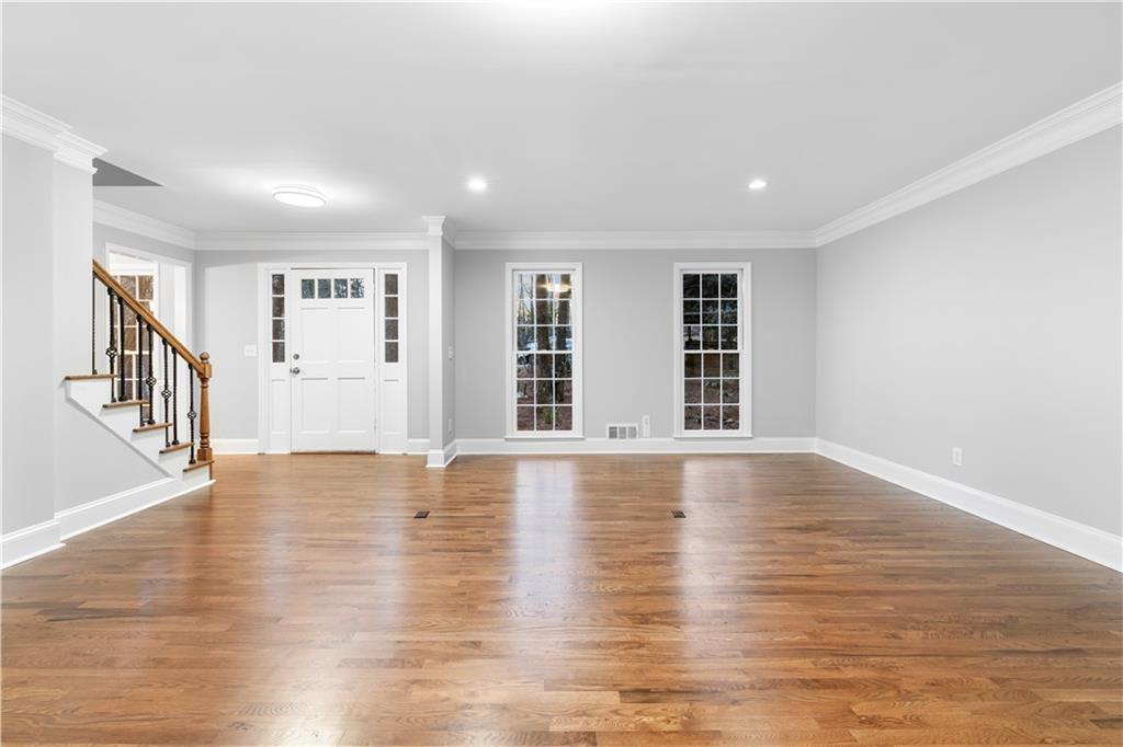 3907 Brinton Mill Road Marietta, GA 30062 - Photo 16 of 61 a view of an empty room with wooden floor and a window