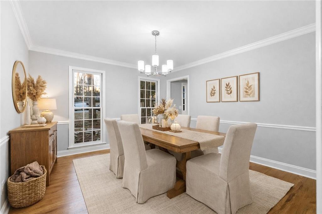 3907 Brinton Mill Road Marietta, GA 30062 - Photo 17 of 61 a view of a dining room with furniture and chandelier