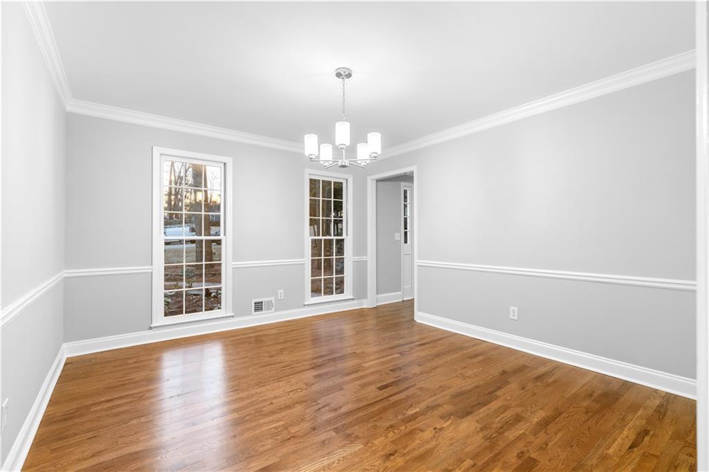 3907 Brinton Mill Road Marietta, GA 30062 - Photo 18 of 61 wooden floor in an empty room with a window