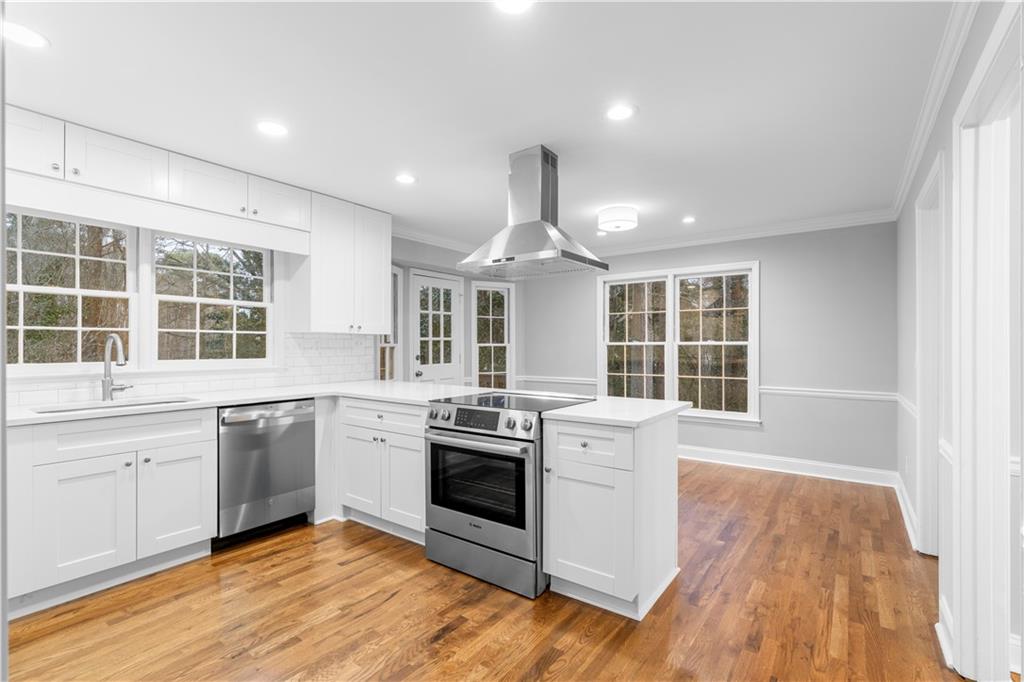 3907 Brinton Mill Road Marietta, GA 30062 - Photo 20 of 61 a kitchen with stainless steel appliances granite countertop a stove and a sink