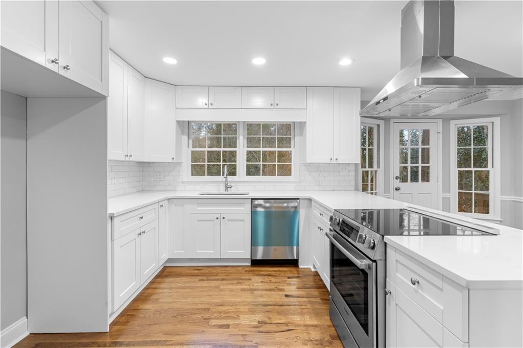 3907 Brinton Mill Road Marietta, GA 30062 - Photo 21 of 61 a kitchen with stainless steel appliances granite countertop a stove and a sink