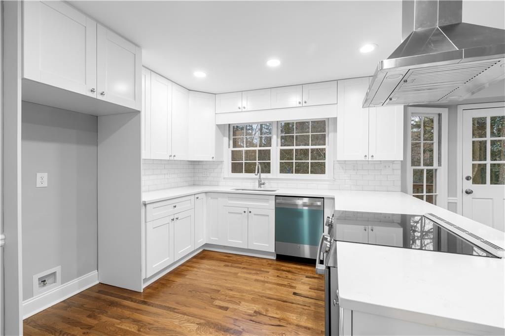 3907 Brinton Mill Road Marietta, GA 30062 - Photo 24 of 61 a kitchen with a stove a sink and a refrigerator