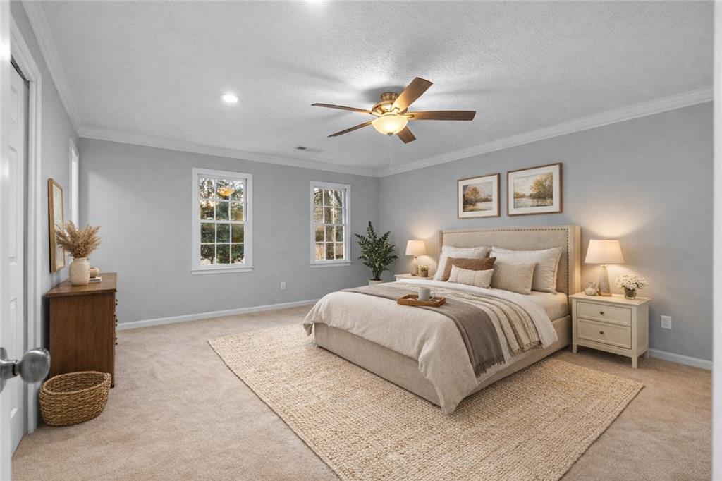3907 Brinton Mill Road Marietta, GA 30062 - Photo 29 of 61 a bedroom with a bed and a chandelier