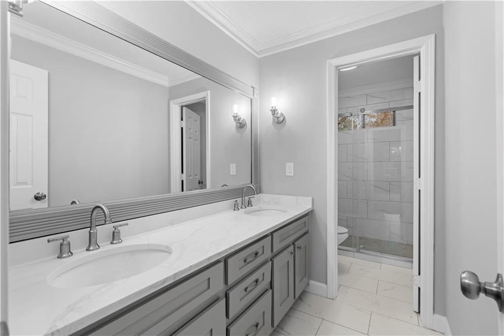 3907 Brinton Mill Road Marietta, GA 30062 - Photo 32 of 61 a bathroom with a granite countertop sink mirror and double