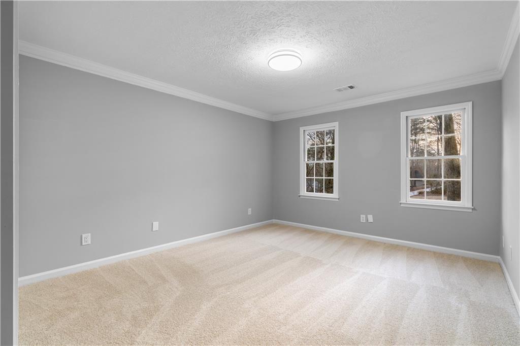 3907 Brinton Mill Road Marietta, GA 30062 - Photo 34 of 61 an empty room with windows