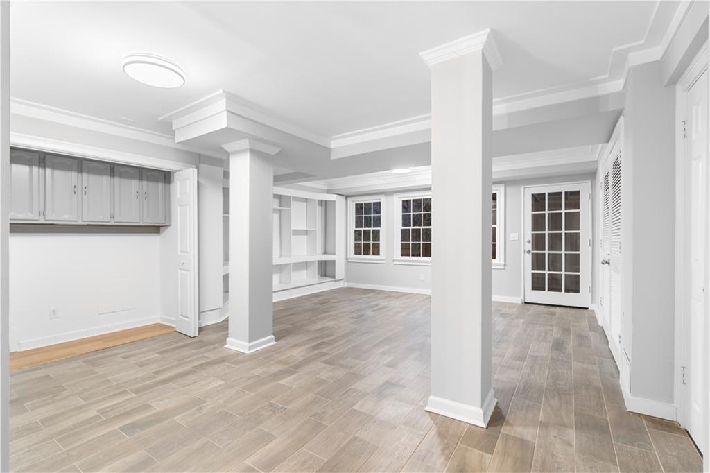 3907 Brinton Mill Road Marietta, GA 30062 - Photo 38 of 61 a view of an empty room with wooden floor and a window