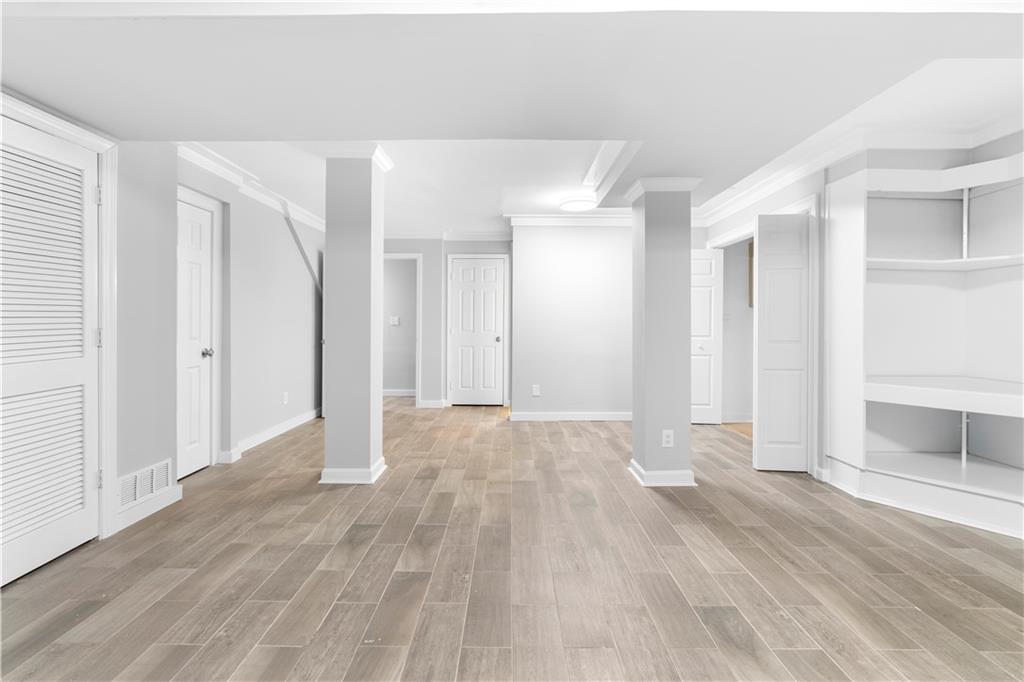 3907 Brinton Mill Road Marietta, GA 30062 - Photo 39 of 61 a view of an empty room with wooden floor