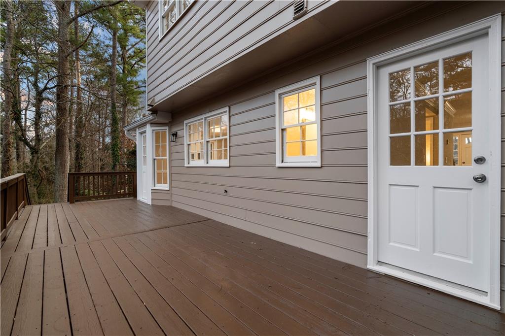 3907 Brinton Mill Road Marietta, GA 30062 - Photo 48 of 61 a view of house with backyard and wooden floor