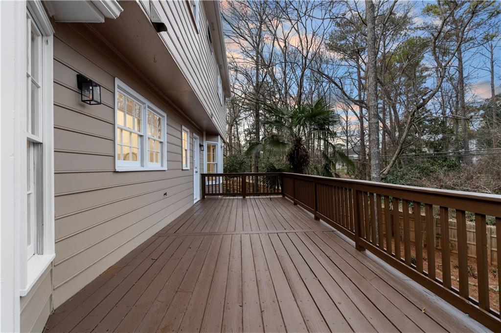 3907 Brinton Mill Road Marietta, GA 30062 - Photo 49 of 61 a view of balcony with wooden floor and fence and floor to ceiling window