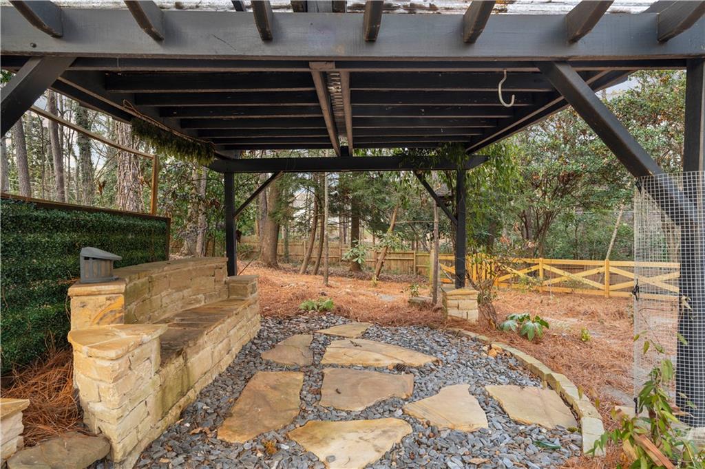 3907 Brinton Mill Road Marietta, GA 30062 - Photo 54 of 61 a view of a backyard with a wooden fence