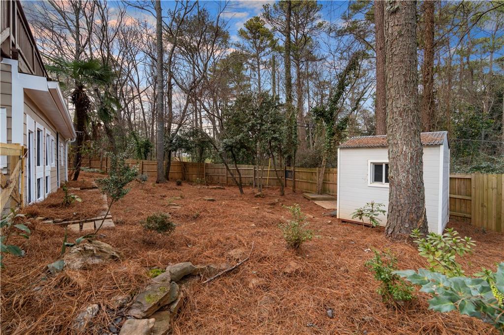 3907 Brinton Mill Road Marietta, GA 30062 - Photo 55 of 61 a backyard of a house with lots of green space