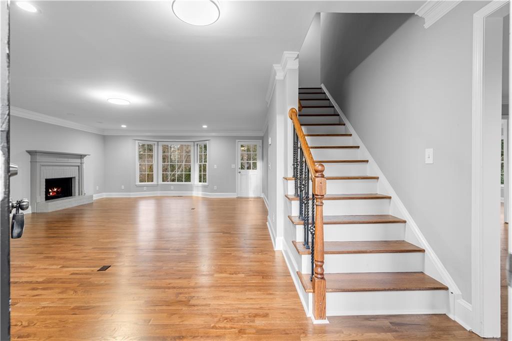 3907 Brinton Mill Road Marietta, GA 30062 - Photo 7 of 61 a view of an empty room with wooden floor and windows