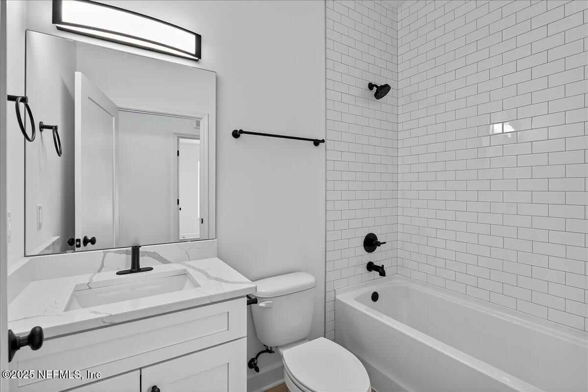 69 Josiah Street St. Augustine, FL 32084 - Photo 20 of 50 a bathroom with a sink toilet and shower