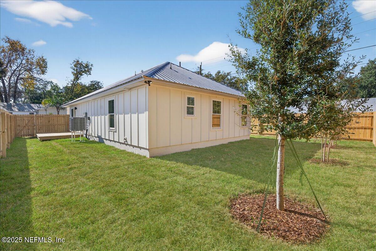 69 Josiah Street St. Augustine, FL 32084 - Photo 37 of 50 a view of a backyard with large trees and plants