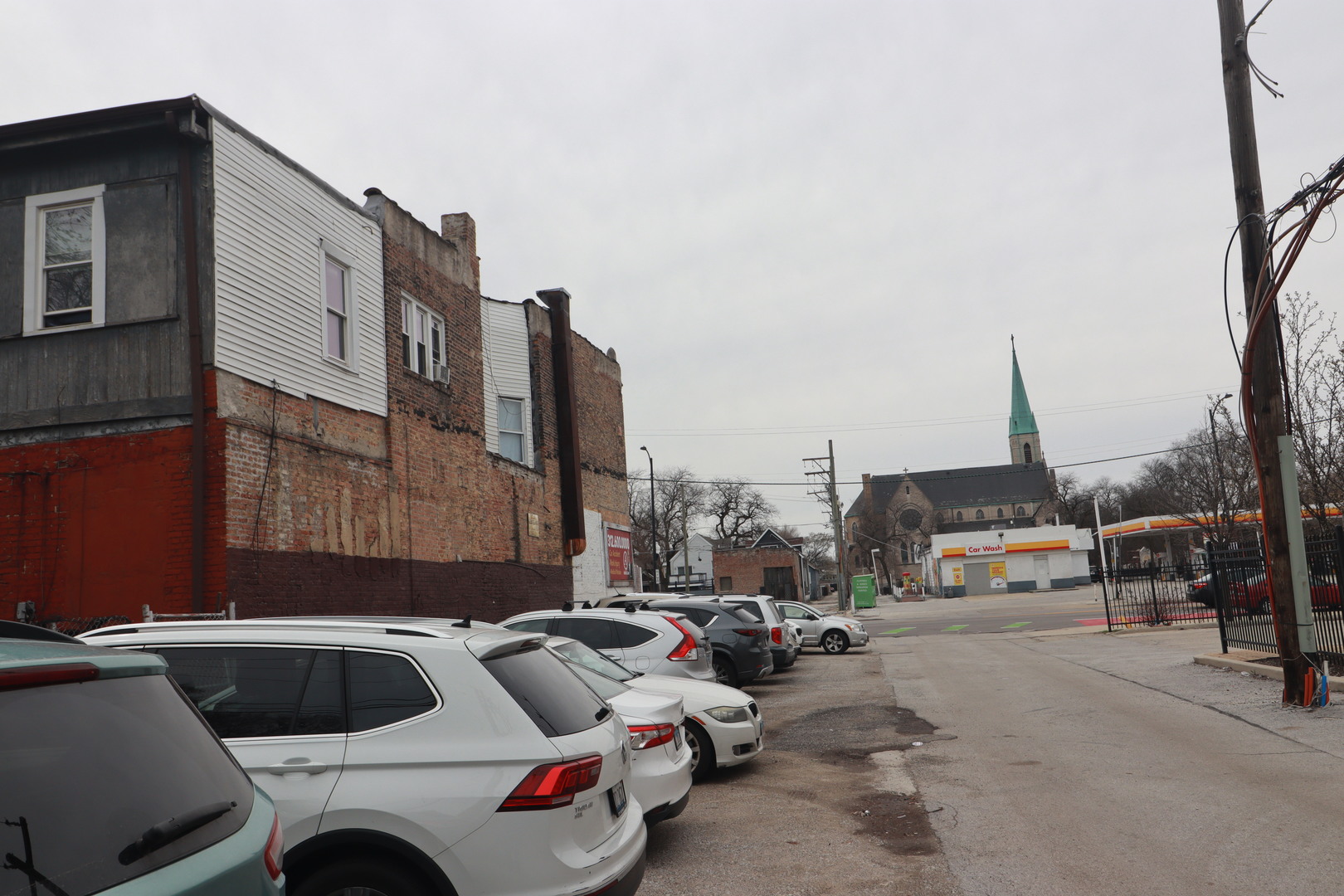 5517 South Halsted Street Chicago, IL 60621 - Photo 4 of 8 a car parked in front of a building